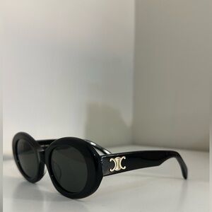 CELINE EYEWEAR
Triomphe oval-frame acetate sunglasses
